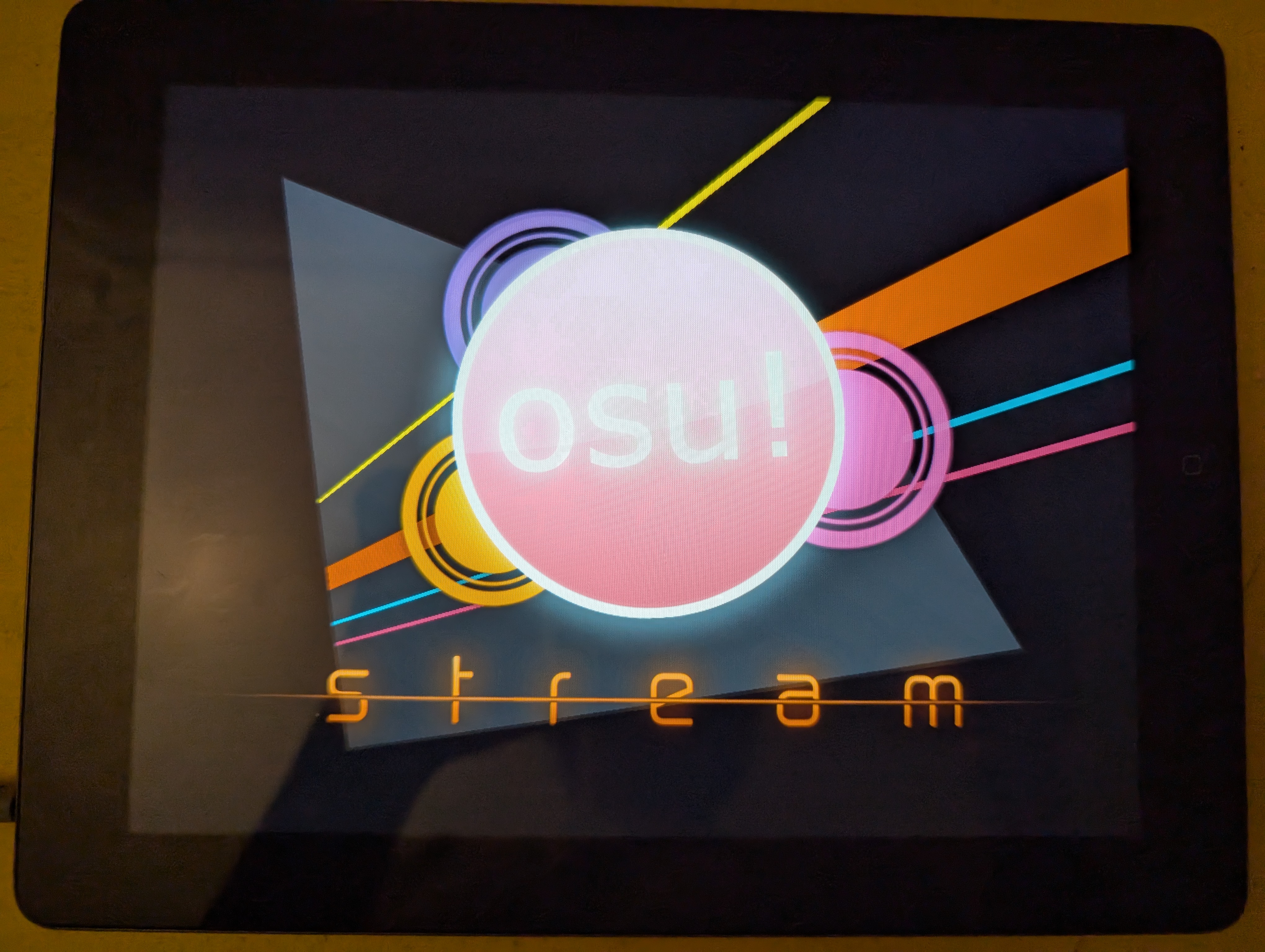 Picture of an IPad 3 in the osu! stream title screen.
